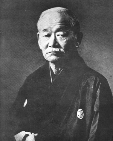 A photographic portrait of Jigoro Kano in later life, in formal dress.